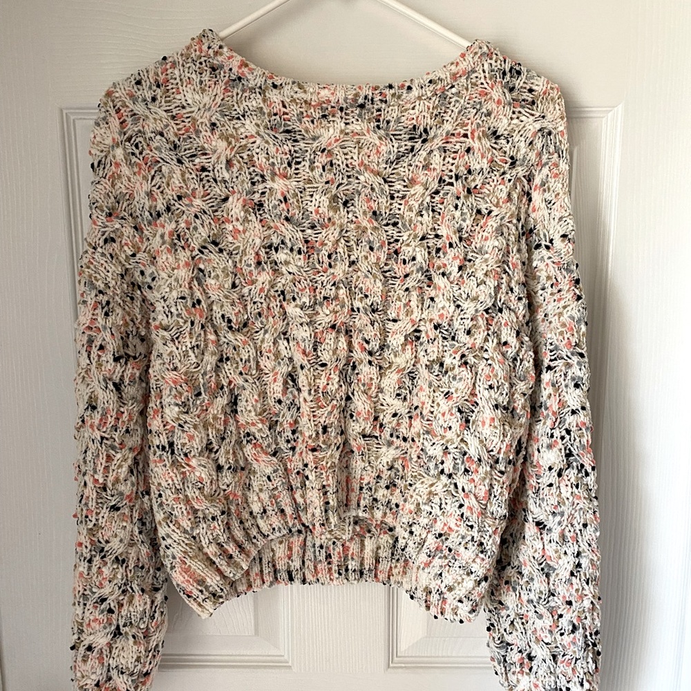 Cream colored cropped sweater with colored details